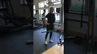 Standing lateral leg lift with band above knees