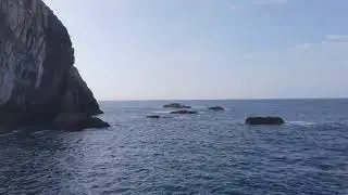Zoom In on Blue Sea Waves Crashing on Rocks | Free 4K Stock Footage