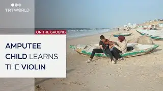 Teenage music instructor teaches amputee child how to play violin