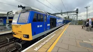 A DC Rail class 60 passing through Acton Main Line station. 