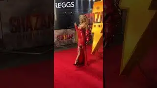 Tallia Storm wearing red latex gown