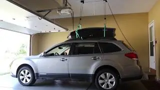 Установка подъемника для хранения грузового бокса на крыше THULE