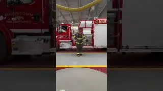 Firefighter getting dressed in bunker gear