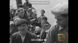AUG 44 CONVOY MOVES TOWARD FRONT AT ALENCON AND SEES; BRITISH SOLDIERS, ARMING FRENCH  - LMWWIIHD226