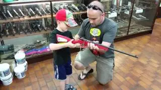 Buying my boy his first rifle.