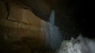 Big Underground Waterfall Pouring out of Hole in the Wall