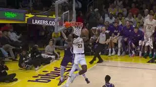 LeBron James with the absolutely sick reverse dunk off a pass by Luka Doncic