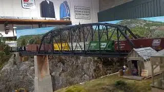 ScaleTrains SDL39 diesels cross a 150' truss bridge.