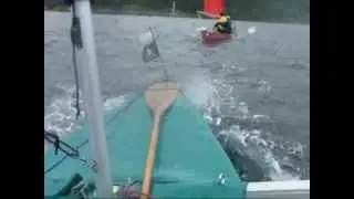Open canoe sailing on Loch Long.
