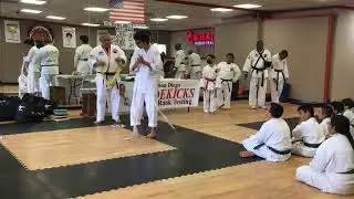 Sidekicks students promotions at testing with Mr Estrada and Grandmaster Orange 