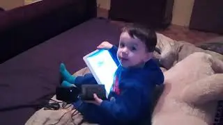 Eddy playing with tablet