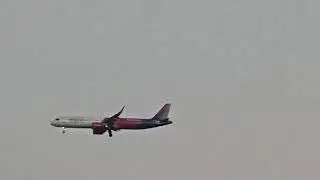Watch a Wizz Air plane passes through the Albanian sky towards Tirana International Airport, Europe