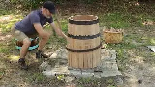 Constructing a beer barrel with hand tools.
