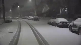 Driving through snowy streets in Dogtown neighborhood in St. Louis Saturday morning