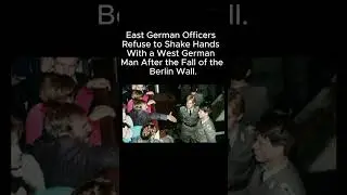 East German Officers refuse to shake hands with a West German man after the fall of the Berlin Wall.