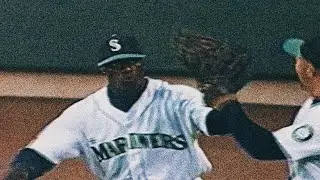 Mike Cameron takes extra bases from Scott Spiezio