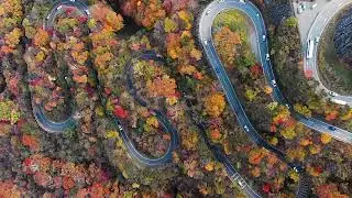 Aerial view with lockdown of 2nd Irohazaka winding road in autumn season, Nikko, Japan. stock video.
