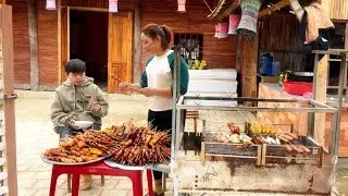 Mai and Binh make and sell grilled skewers in the freezing winter weather.