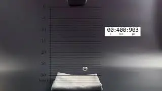 Free-fall motion with scale and timer (Slow Motion)