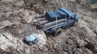 Carrying wood down from the mountain to build a road during the rainy season