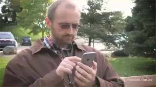 Rodney signs his tax return with his smartphone