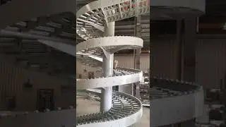 China Chain Spiral Conveyor With Roller Conveyor