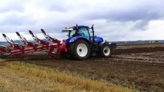 3 New Holland T7 tractors ploughing potato stubble at West Fenton Farm