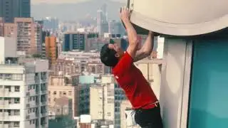 Alex Honnold free solo climbing the 11th tallest building in the world with no ropes
