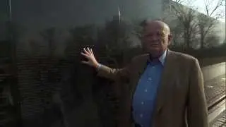 General Gordon R. Sullivan at the Wall discussing Norwich classmates