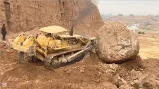 Dozer Pushing A Big Rock 