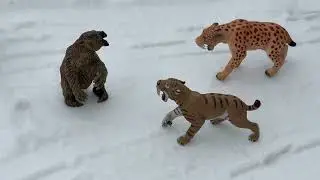 2 Saber Tooth Cats hunting a Giant Ground Sloth
