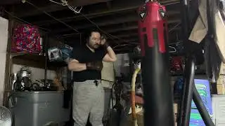 Throwing 100 punches on newly filled 127lb 5ft heavy bag by rdx with sanabul 6oz mma gloves 