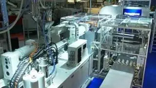Krauss Maffei KM600-3500 running 2 x 8 cavity stack mould for thin wall containers