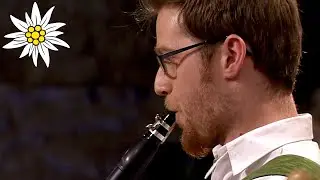 Folk band plays catchy polka and uses spoons as instruments