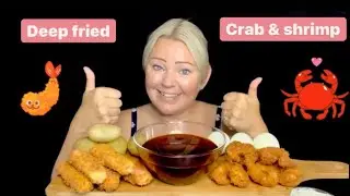 Deep fried seafood boil, crab sticks and shrimp with potatoes and boiled eggs