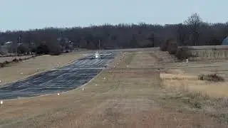 Cessna 310 taking off.