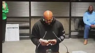Reverand John Amanchukwu reads book 