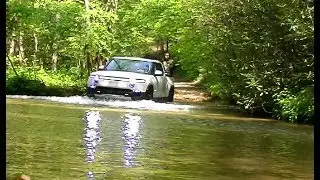 RIVIAN traversing Fightingtown Creek in Cashes Valley, GA