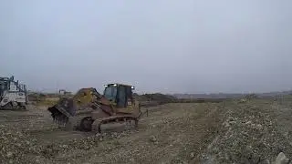 963D track loader: pushing and stacking rock millings