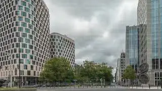 Timelapse panorama of traffic and modern office buildings in the business district on Boulevard