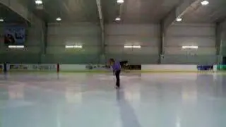 Flying camel spin with arm variation