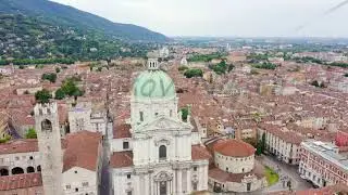 Brescia, Italy. Cathedral of Santa Maria Assunta. Flight over the city in cloudy weather, Aerial Vi