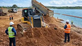 Great SHANTUI Dozer Pushing Dirt with Smoothly Construction Equipment in Action with Dump Trucks