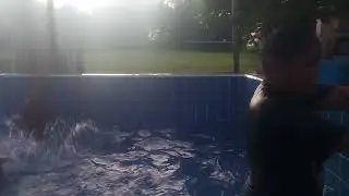 kids are jumping and playing together swimming pool birthday party