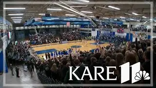 High school basketball fans pack the stands at Wayzata-Hopkins matchup