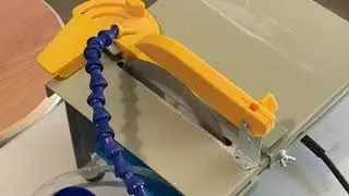 Watch me cut this Black opal in half with a fine saw trying to find colours that may not be there.