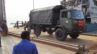 The army convoy is leaving the ferry(সেনাবাহিনীর গাড়ি বহর ফেরিঘাট ত্যাগ করছে) Paturia Ferry Ghat