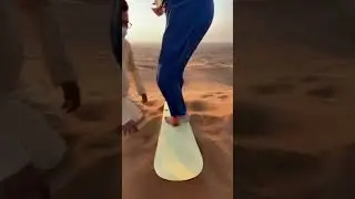 Sand boarding in desert Dubai