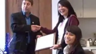 Erin receiving an award for working 150 volunteer hours