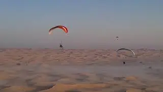Paramotor flying over foggy desert in Dubai !